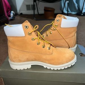 Beige Timberlands with White. Kids size 6.5 equivalent to women’s 8